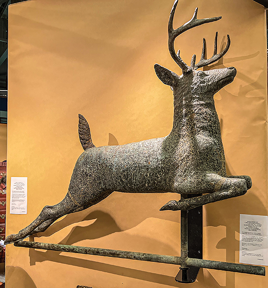 The repoussé copper and cast-zinc leaping stag weathervane, attributed to L.W. Cushing & Sons, Waltham, Massachusetts, is much larger (36