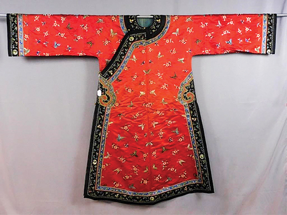 This 19th-century Qing Dynasty Manchu woman’s silk changyi (informal robe) is embroidered with flowers and butterflies and lined with light blue polished cotton. Estimated at $800/1200, it sold for $7500. From the Webb estate, it is headed to a buyer in mainland China. All the textiles in the auction were pristine.