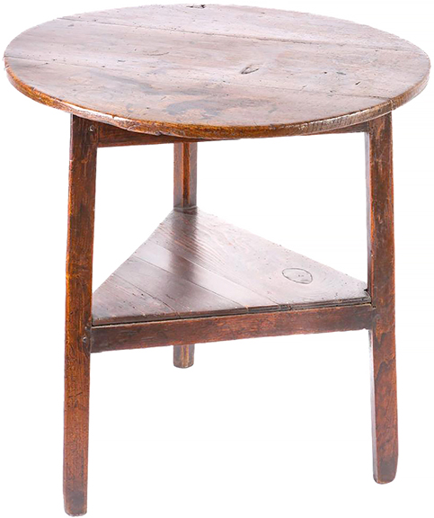 This 18th-century oak cricket table with a round top, lower triangular shelf, and splayed legs, 28