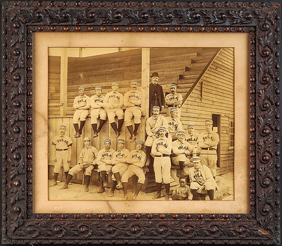 The highlight of a group of sports memorabilia was a home run. A team photo of the Philadelphia Phillies from the 1890 season sold for $11,780 (est. $200/400). That year the Phillies finished third in the National League. Until that year the team was known as the Philadelphia Quakers. The picture appears to be in fine condition and depicts the players, a boy, and a man in a suit and top hat, alongside and on a grandstand.