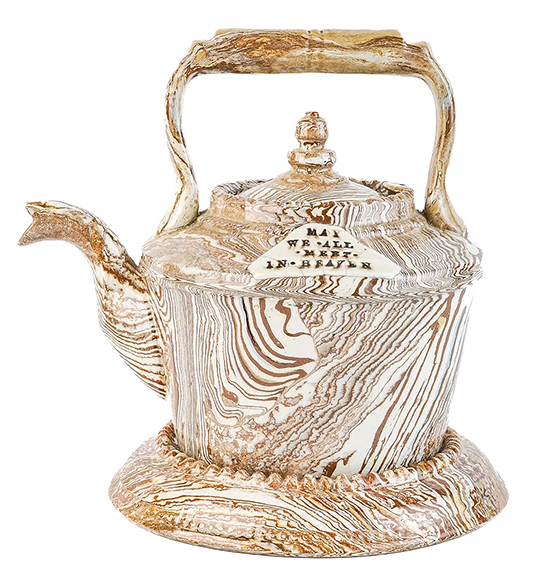 This scroddled yellowware teapot with an undertray, circa 1850, is rare and sold for $744 (est. $200/400). An attached triangular plaque bears the inscription “May We All Meet In Heaven.”