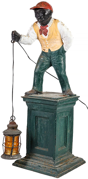  This cast-iron lawn jockey holding a brass lantern (not original), 43