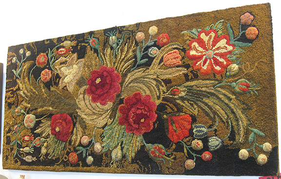 Bob Zordani and Heidi Kellner of Z & K Antiques, Lexington, Virginia, tagged this lush floral hooked rug “sold” on opening morning.