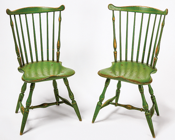 The pair of fan-back Windsor chairs, circa 1780, made in the Northeast was given a 19th-century coat of apple-green paint with yellow highlights and sold for $6250 (est. $2000/4000). They are ex-Paul Flack. Garthoeffner collection.