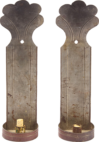 The tin sconces, circa 1840, decoratively incised, each 16