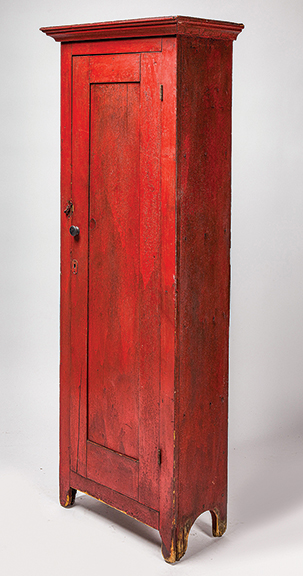The chimney cupboard in unusual and original cherry-red paint was made somewhere in the Northeast United States between 1830 and 1840. Diminutive at 67