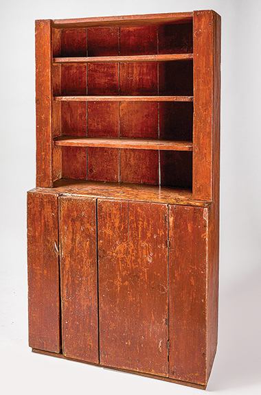 This New England stepback cupboard in early red paint with square-nail construction, circa 1820, sold for $1860 (est. $400/800).