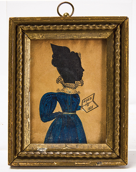 Attributed to the Puffy Sleeve Artist, this miniature silhouette of a young woman holding a paper inscribed “Aged 15 1831” hangs in a period frame thought to be the original. Estimated at $2000/4000, the 3 5/8