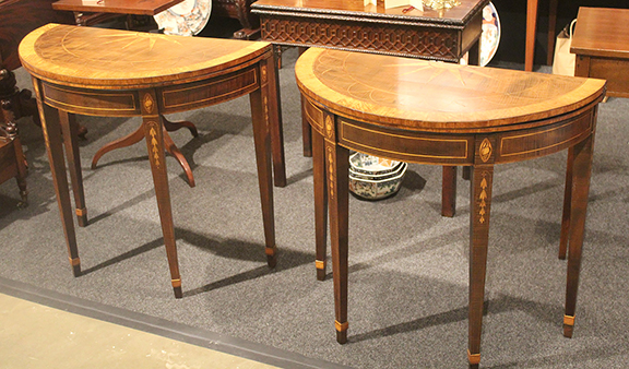 John “Jay” Gates of Gates Antiques Ltd., Midlothian, Virginia, offered this pair of intricately inlaid circa 1790 English card tables. Each table top flips up to reveal a green felt game surface. When folded, the edges of the tables are constructed with a mortise and tenon so that they securely join together, revealing a large compass design. The underlying spruce and oak frames are veneered and inlaid with tiger maple, cherry, and satinwood. The pair was tagged $11,950.