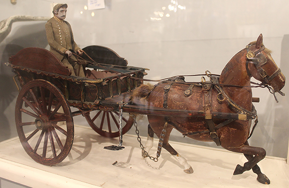 Period to Mod/Brennan & Mouilleseaux Antiques & Design, Briarcliff Manor, New York, offered this circa 1890 delivery cart. The cart is decorated with various colorful tulip designs. The cart lettering reads “FRUITEERS AND GREEN GROCERS” and “F. A. MILLER.” The horse and cart were priced at $2650.